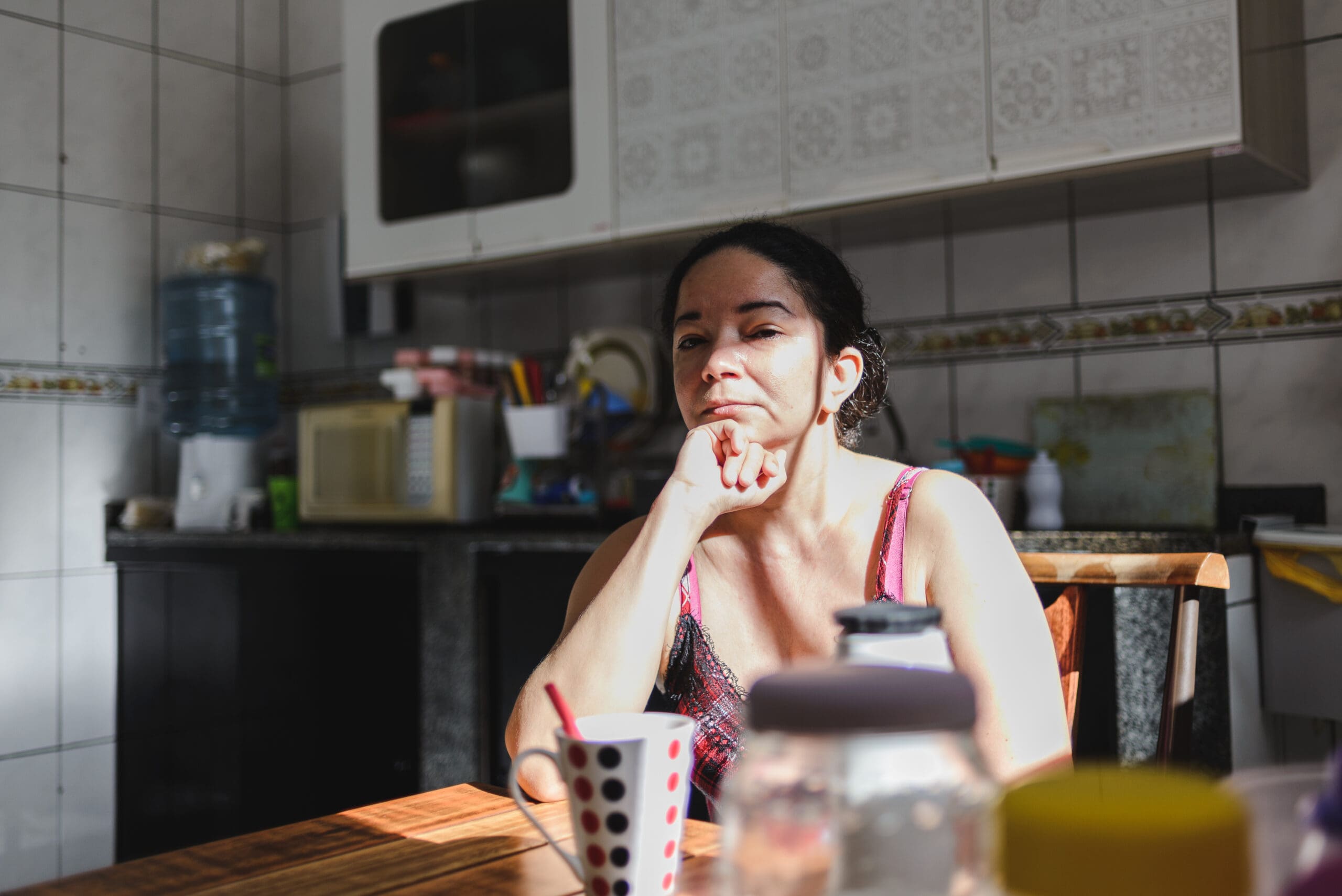 Real portrait of mature woman at home kitchen in the morning