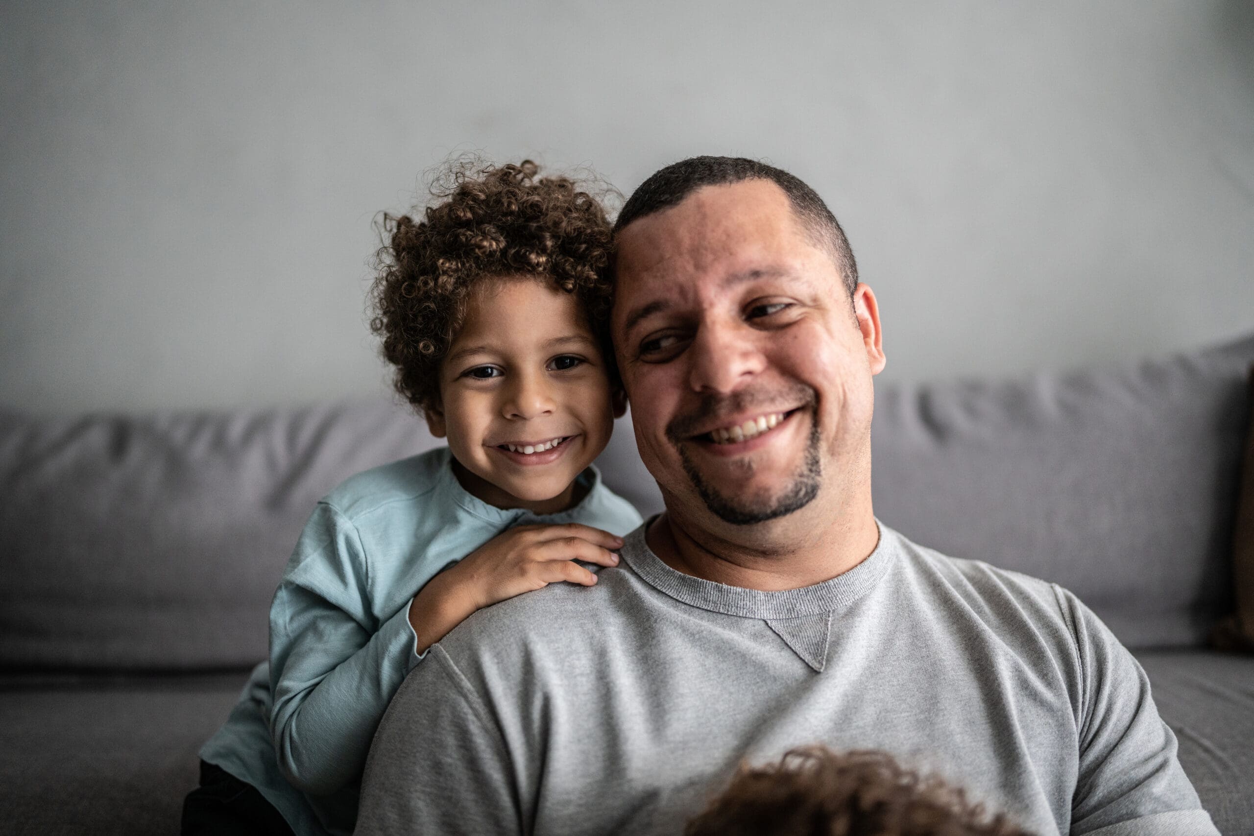 Portrait of father and son at home